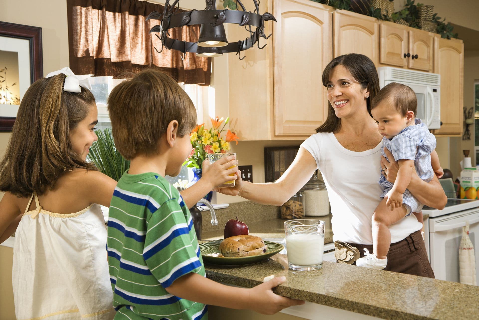 bigstock-Hispanic-family-in-kitchen-wit-12841910.jpg